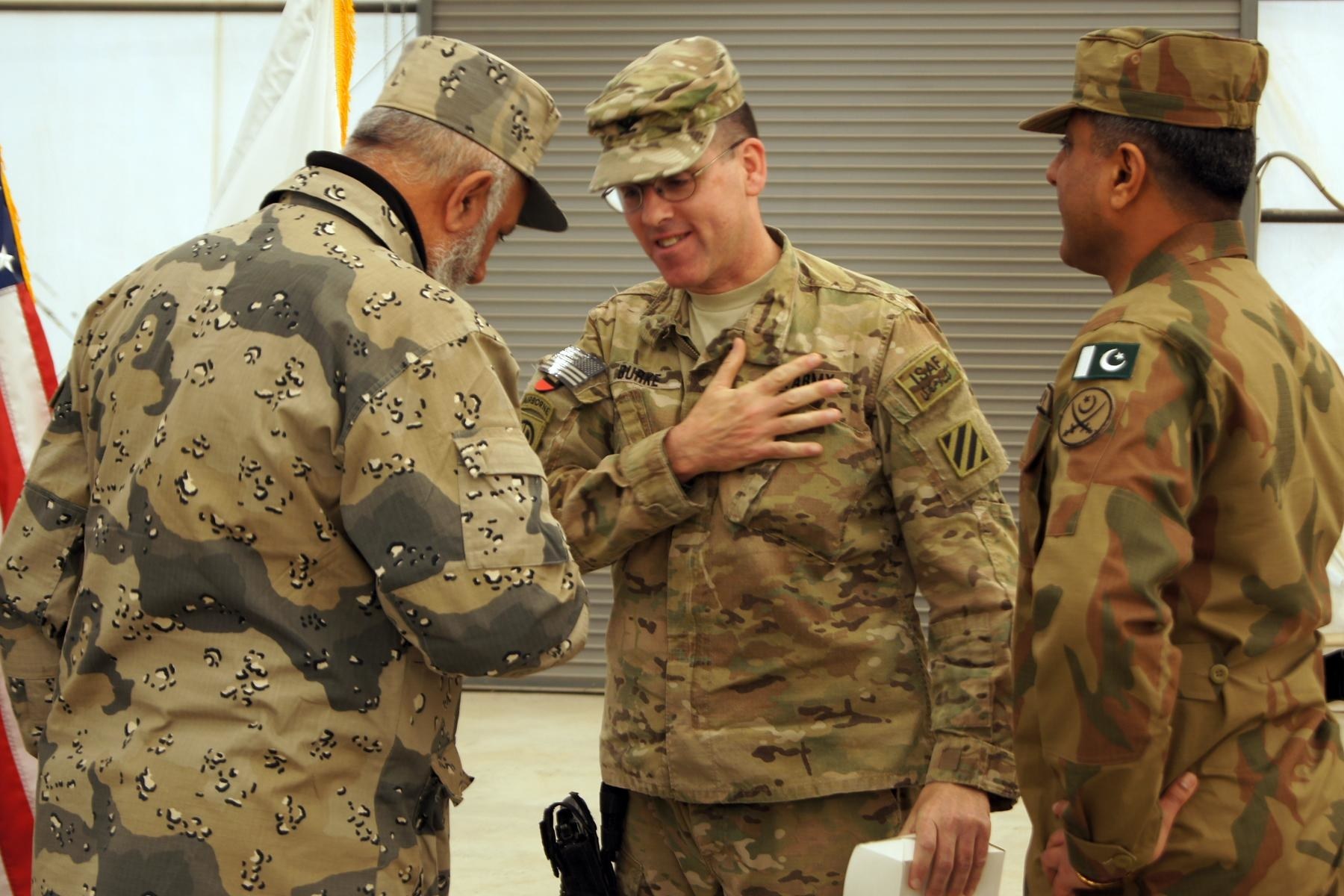 U.S. and Pakistani soldiers greet each other on the Afghanistan border, January 2013. (Photo Courtesy: US Army)
