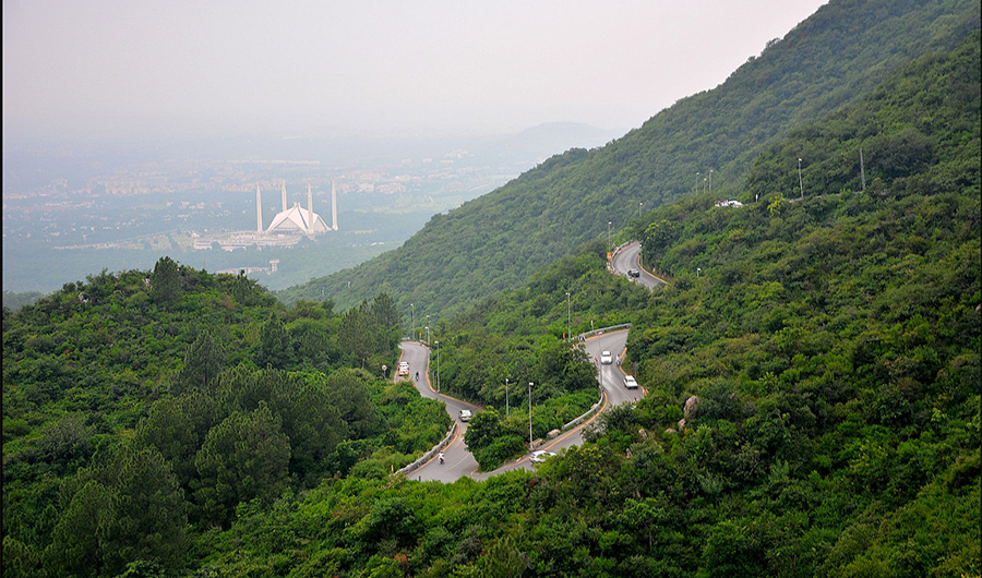 A view of the Margalla Hills with Faisal Mosque in the distance. Since 1980, the Margalla Hills have been a protected and maintained site by the city's Capital Development Authority. Sept. 13, 2019 (Obaid Khan, Wikipedia)
