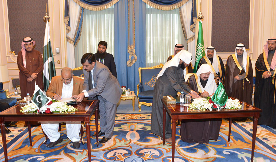 In this photo, Speaker of the National Assembly of Pakistan, Asad Qaisar and Chairman of Saudi Shoura Council, Dr Abdullah Al-Sheikh sign a memorandum of understanding (MoU) between Pakistan and Saudi Arabia on Dec 23, 2019 in Riyadh, Saudi Arabia. (Photo Courtesy: Saudi Shoura Council Twitter)