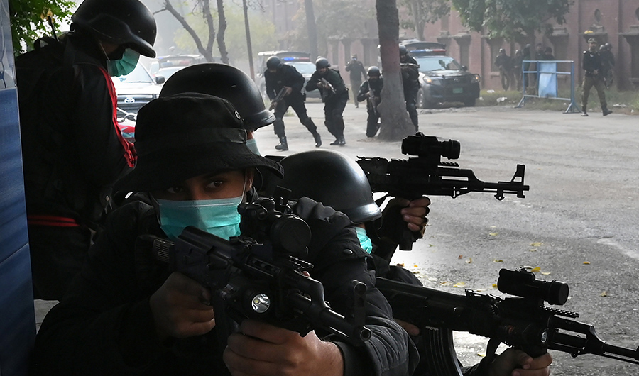 Pakistani police commandos take part in an anti-terrorism drill outside the Marriyam Muqaddasa Church ahead of Christmas celebrations in Lahore on December 23, 2019. (AFP)