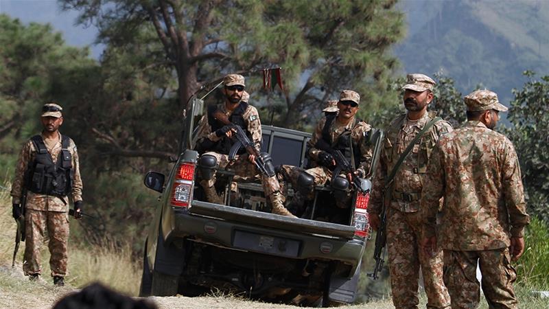 Pakistani soldiers patrol at a forward post on the LoC that divides Kashmir between Pakistan and India. (AP)