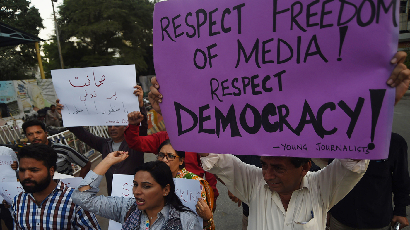 In this file photo, Pakistani journalists and civil society activists hold placards during a protest in Karachi on Oct. 28, 2017. (AFP)