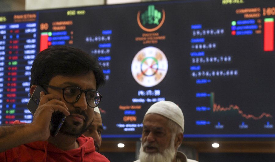 Stockbrokers monitor latest share prices during a trading session at the Pakistan Stock Exchange (PSX) in Karachi on January 6, 2020. (AFP)