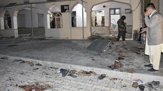 Pakistani security officials examine the site of bomb explosion at a mosque in Quetta on Jan. 11, 2020. (AP)
