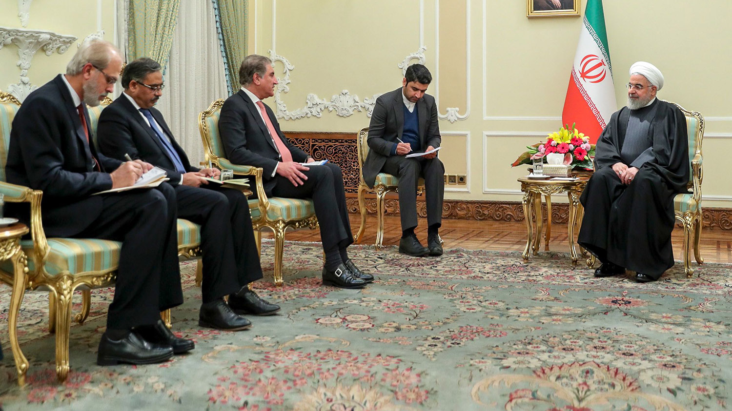 A handout picture provided by the official website of the Iranian Presidency shows Pakistan's Foreign Minister Shah Mahmood Qureshi (2nd-L) meeting with Iranian President Hassan Rouhani (R) in Tehran on Jan. 12, 2020. (Iranian Presidency via AFP)