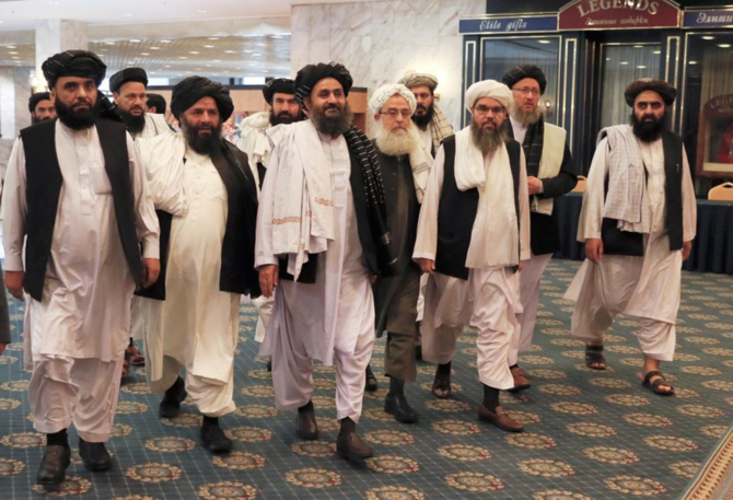 Members of a Taliban delegation, led by chief negotiator Mullah Abdul Ghani Baradar (C, front), walk before a meeting with Afghan senior politicians in Moscow, Russia May 30, 2019. (REUTERS PHOTO)