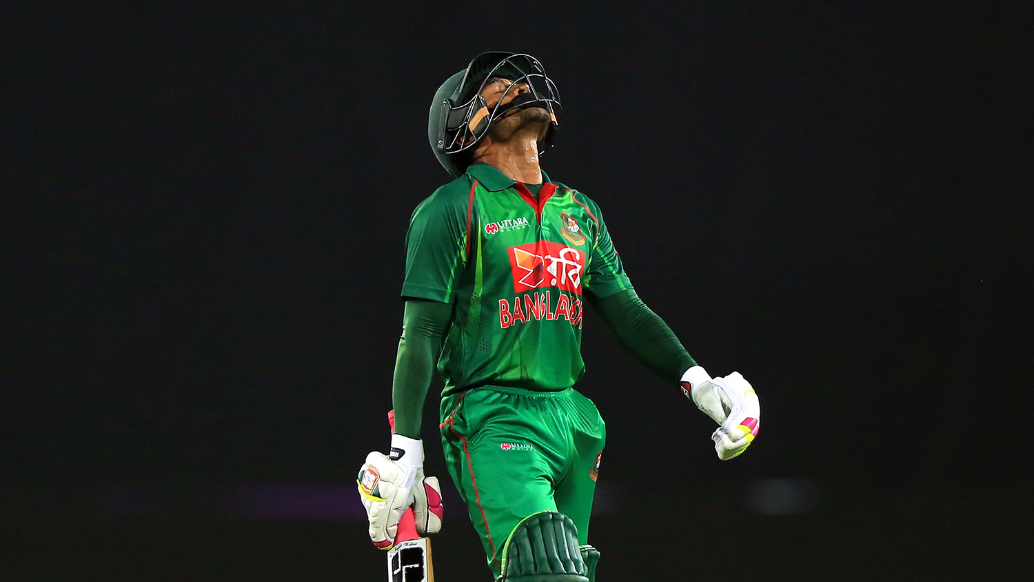 In this file photo, Bangladesh cricketer Mushfiqur Rahim walks back to the pavilion after his dismissal during the first one day international (ODI) cricket match between Bangladesh and England at the Sher-e-Bangla National Cricket Stadium in Dhaka on Oct. 7, 2016. (AFP)