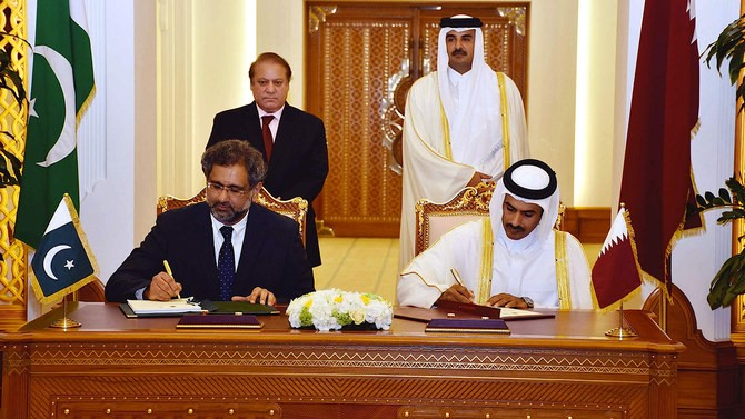 In this file photo, Shahid Khaqan Abbasi and then Qatargas chairman Saad Sherida Al-Kaabi are seen signing an agreement in Doha, Feb. 10, 2016. (PID photo)