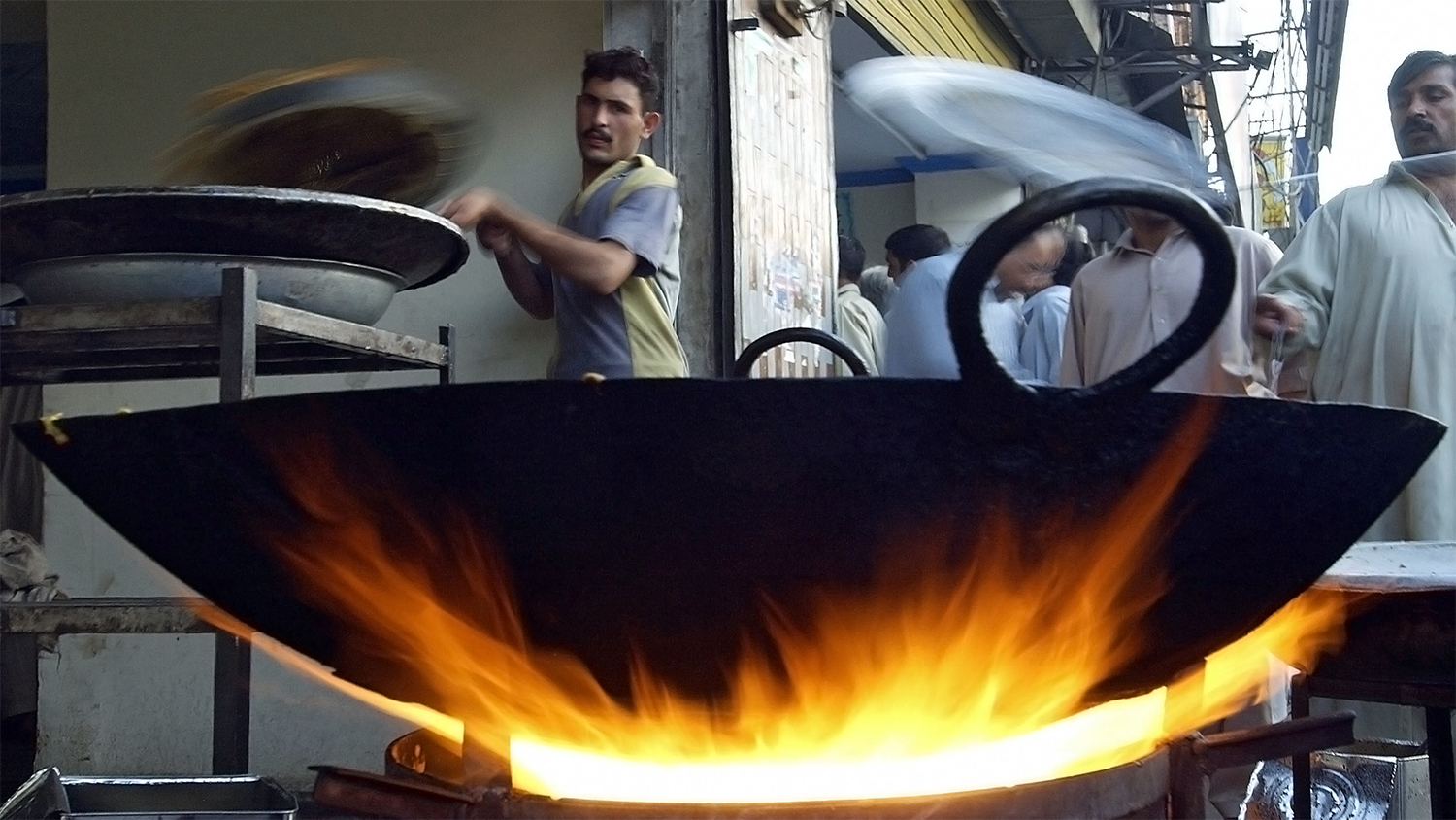 In this file photo, Pakistani cooks work to prepare Iftar outside a shop in Rawalpindi on Oct. 29, 2003. (AFP)