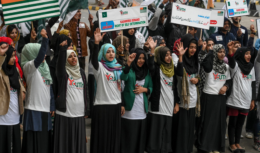 Youth shout slogans during a protest demanding the implementation of the United Nations resolution on Kashmir to mark the Right to Self-determination Day, in Lahore on January 5, 2020. (AFP)