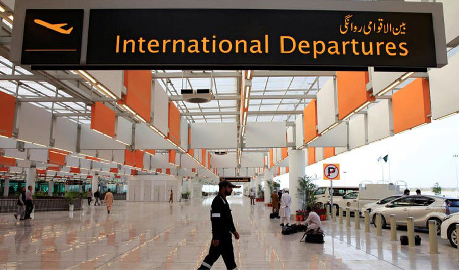 A worker walks at the departure area of the Islamabad International Airport on April 18, 2018. (Reuters)