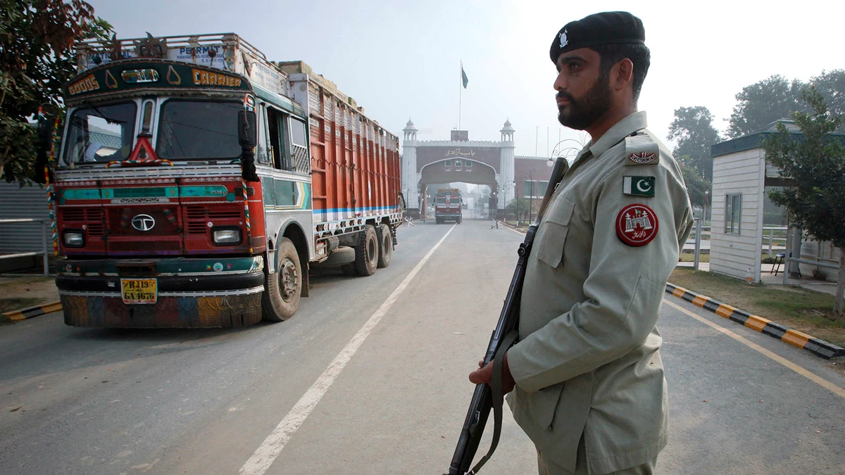 In this file photo, a paramilitary soldier stands guard as a truck crosses into Pakistan from India at the Wagah border. (REUTERS/File)