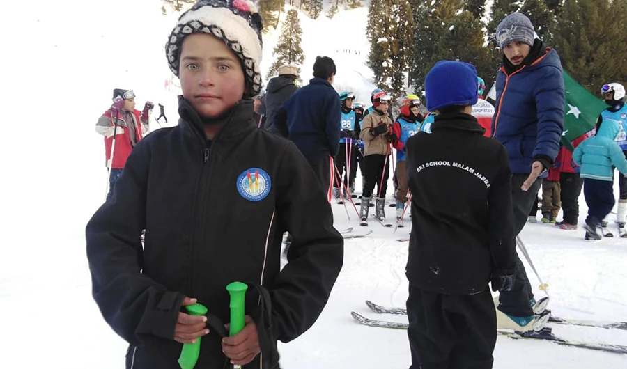 7-year-old Zubaida Khan poses for a photo at the Malam Jabba Ski Resort on January 17, 2020. Khan used to sell boiled eggs to tourists in her native town, but she is now a trained athlete who aspires to compete in international skiing competitions. (AN Photo)