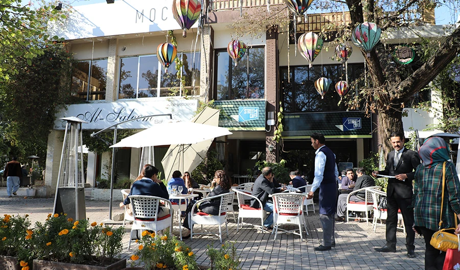 People enjoy their coffee at Kohsar Market, one of Islamabad's favorite meetup areas, Jan. 22, 2020. (AN photo)