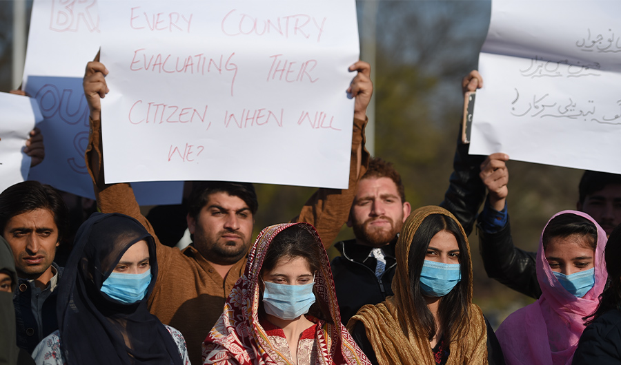 Students and family members of Pakistani students living in the Chinese city of Wuhan, protest demanding their return home, in Islamabad on February 1, 2020. (AFP)