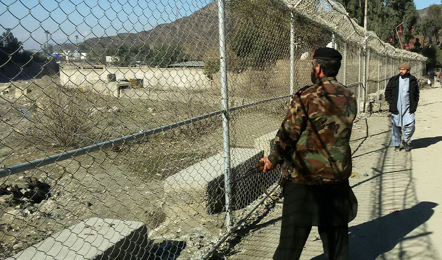 In this photograph taken on February 9, 2017, a Pakistani border security soldier stands alert at the border between Pakistan and Afghanistan at the Torkham Border Post in Pakistan's Khyber Agency. (AFP)