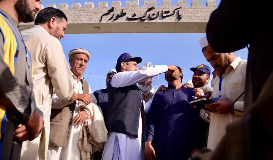 In this photo, a polio worker administers polio drops to an Afghan national on the Pak-Afghan Torkham border in July, 2019. (Photo Courtesy - Emergency Operation Center Khyber Pakhtunkhwa)