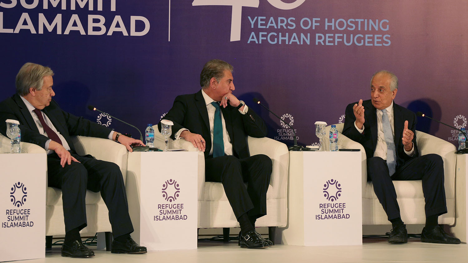 US envoy for peace in Afghanistan Zalmay Khalilzad, Pakistan’s foreign minister Shah Mahmood Qureshi and United Nations Secretary-General Antonio Guterres attend an international conference on the future of Afghan refugees living in Pakistan, organized by the Pakistan and the UN Refugee Agency in Islamabad on Feb. 17, 2020. (REUTERS)
