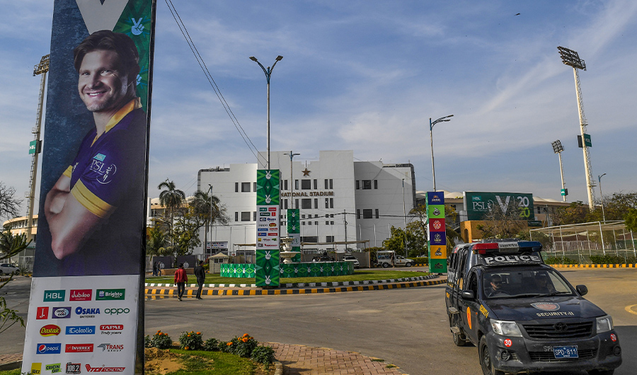 Policemen sit in a police vehicle outside the National Stadium during a practice session for the upcoming 2020 Pakistan Super League (PSL) in Karachi on February 18, 2020. (AFP)
