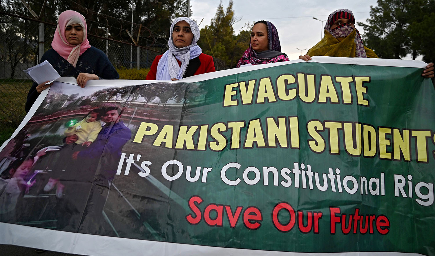 Parents and relatives of Pakistani students in the Chinese city of Wuhan, where the outbreak of the COVID-19 coronavirus began, hold placards during a protest to demand Pakistan's government the evacuation of their loved ones in Islamabad on Feb. 19, 2020. (AFP)