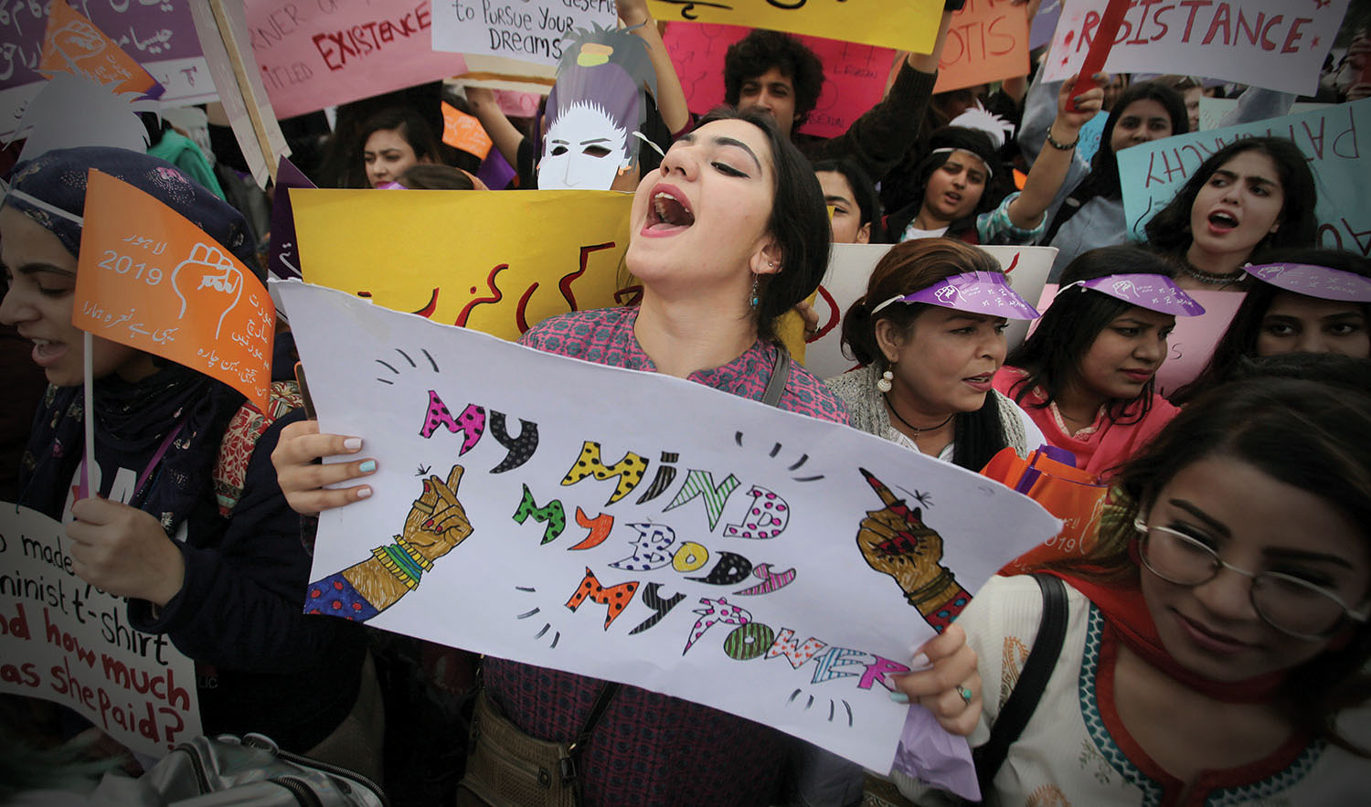In this file photo, a woman carries a sign and chants slogans during a rally to mark International Women's Day in Lahore on March 8, 2019. (REUTERS)
