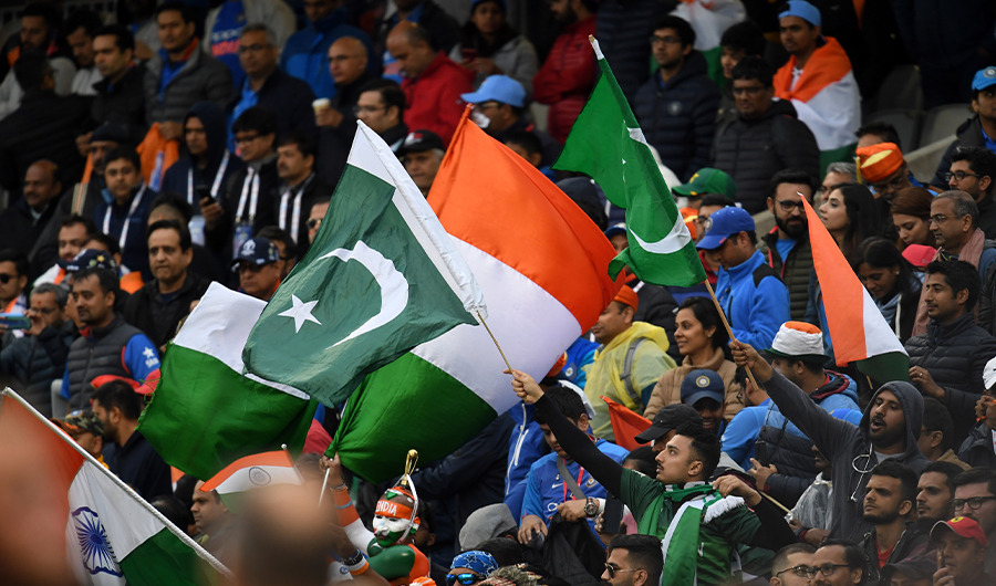 Spectators wave national flags after the 2019 Cricket World Cup group stage match between India and Pakistan at Old Trafford in Manchester, northwest England, on June 16, 2019. (AFP)