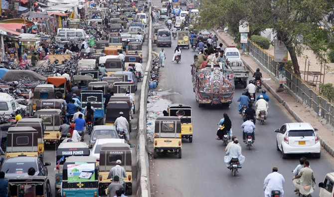 This photo taken on July 17, 2018 shows Pakistani commuters driving along a street in Karachi. (AFP)