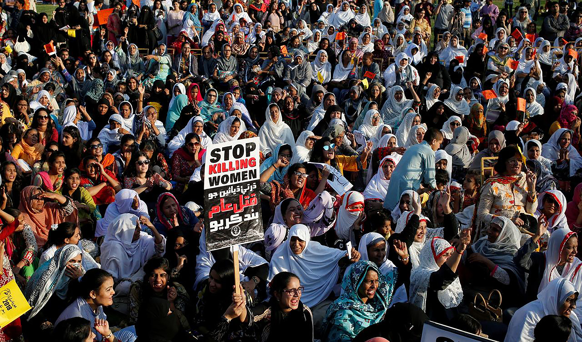 In this file photo, people hold signs and chant slogans as they take part in an Aurat March, or Women's March in Karachi on March 8, 2018. (REUTERS)