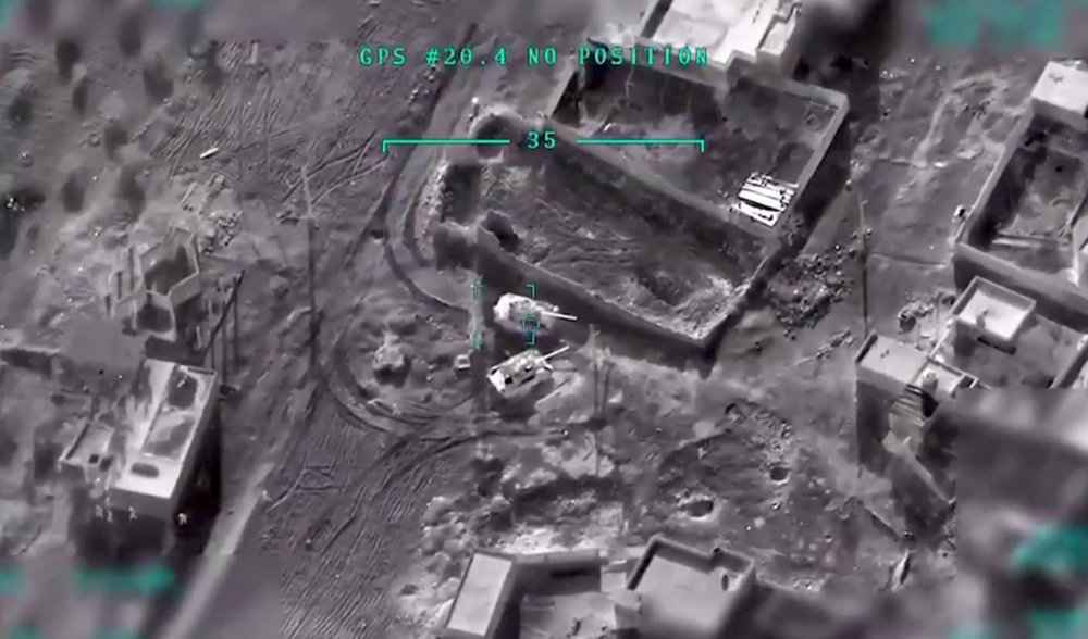 A screengrab taken from a video released by the Turkish Defence Ministry on March 1, 2020 shows an airstrike by the Turkish military on Syrian regime positions. (Handout/Turkish Defence Ministry via AFP)