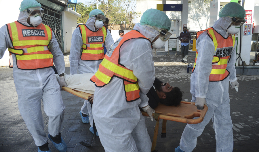 Pakistani rescue personnel take part in drill exercise as a preventive measure for the spread of the of COVID-19 coronavirus, in Peshawar on March 1, 2020, as Pakistan has detected two new cases of the novel coronavirus. (AFP)