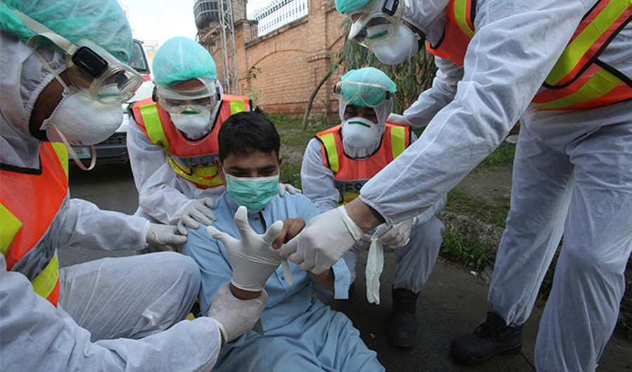 In this photo, Pakistani medical staff are seen taking part in a drill as a preventative measures for coronavirus in Peshawar, Pakistan. (AP)