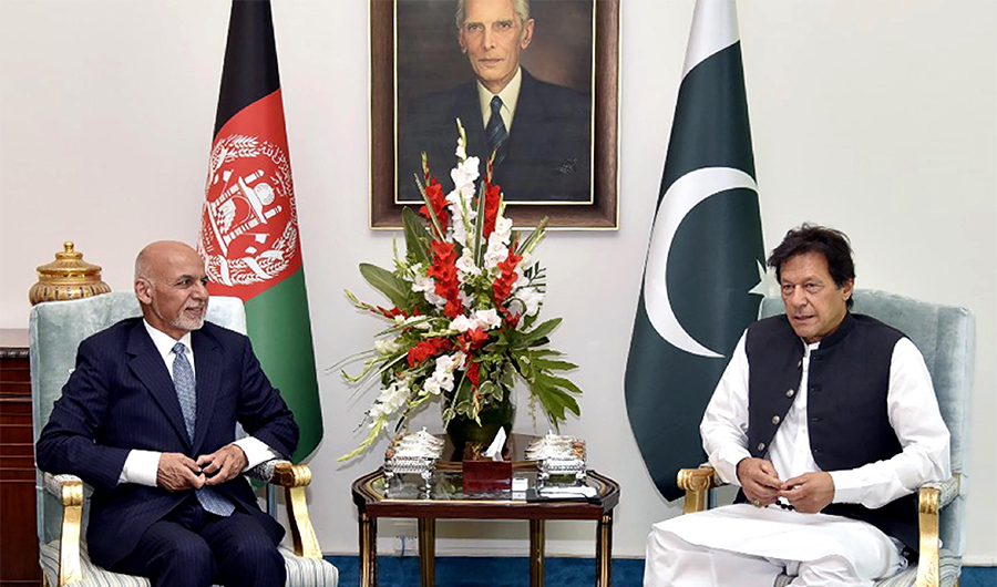 In this handout picture released by Pakistan's Press Information Department (PID) on June 27, 2019, visiting Afghan President Ashraf Ghani (L) talks with Pakistani Prime Minister Imran Khan during a meeting in Islamabad. (AFP)