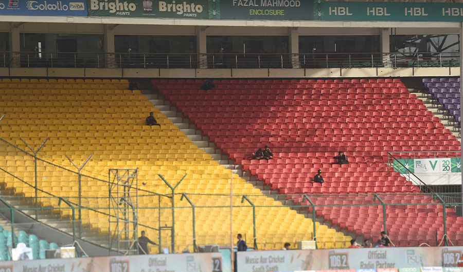 Pakistani paramilitary soldiers sit in empty spectators enclosures amid concerns over the spread of the COVID-19 novel coronavirus, during the T20 cricket match between Karachi Kings and Islamabad United at the National Cricket Stadium in Karachi on March 14, 2020. (AFP)