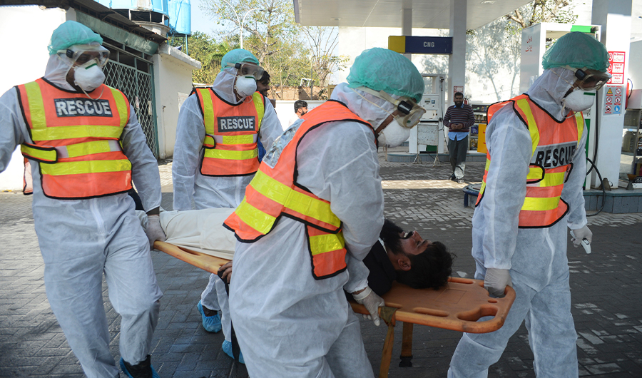 Pakistani rescue personnel take part in drill exercise as a preventive measure for the spread of the of COVID-19 coronavirus, in Peshawar on March 1, 2020. (AFP)