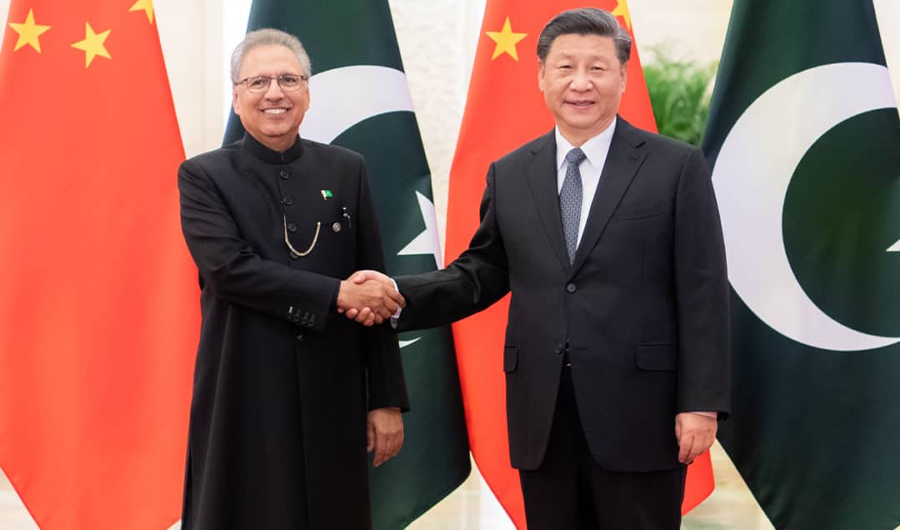 Pakistan President Arif Alvi was photographed shaking hands with his Chinese counterpart, Xi Jinping, in Beijing on March 17, 2020. (Photo by President's office)
