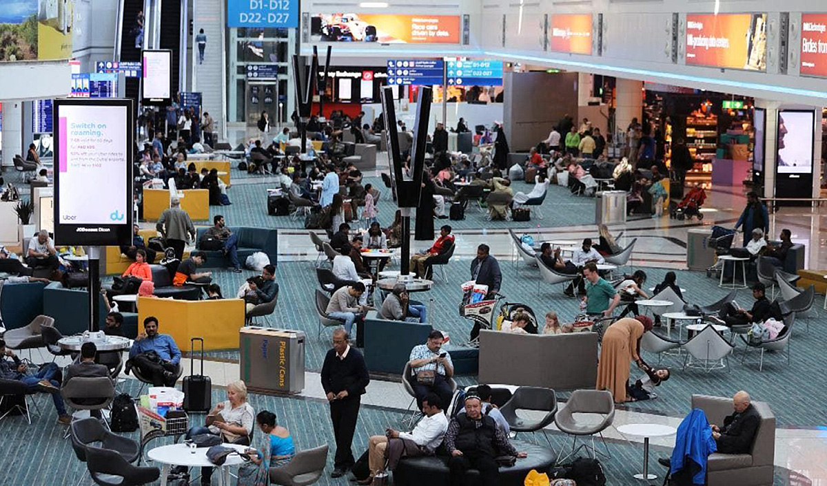 In this file photo, passengers are seen resting in common area at the duty free of terminal one of Dubai Airports in Dubai on Dec. 26, 2018. (REUTERS)