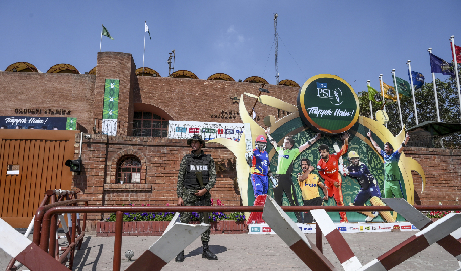 A soldier stands guard outside the Gaddafi Cricket Stadium in Lahore on March 17, 2020. (AFP)