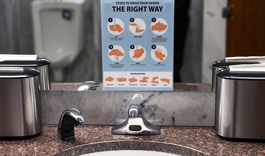 Instructions on correct way of hand washing is posted in a restroom at Hart Senate Office Building March 19, 2020. (AFP)