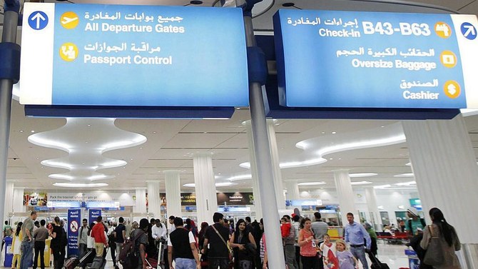 A file photo shows travelers at the Dubai International Airport. (Reuters)
