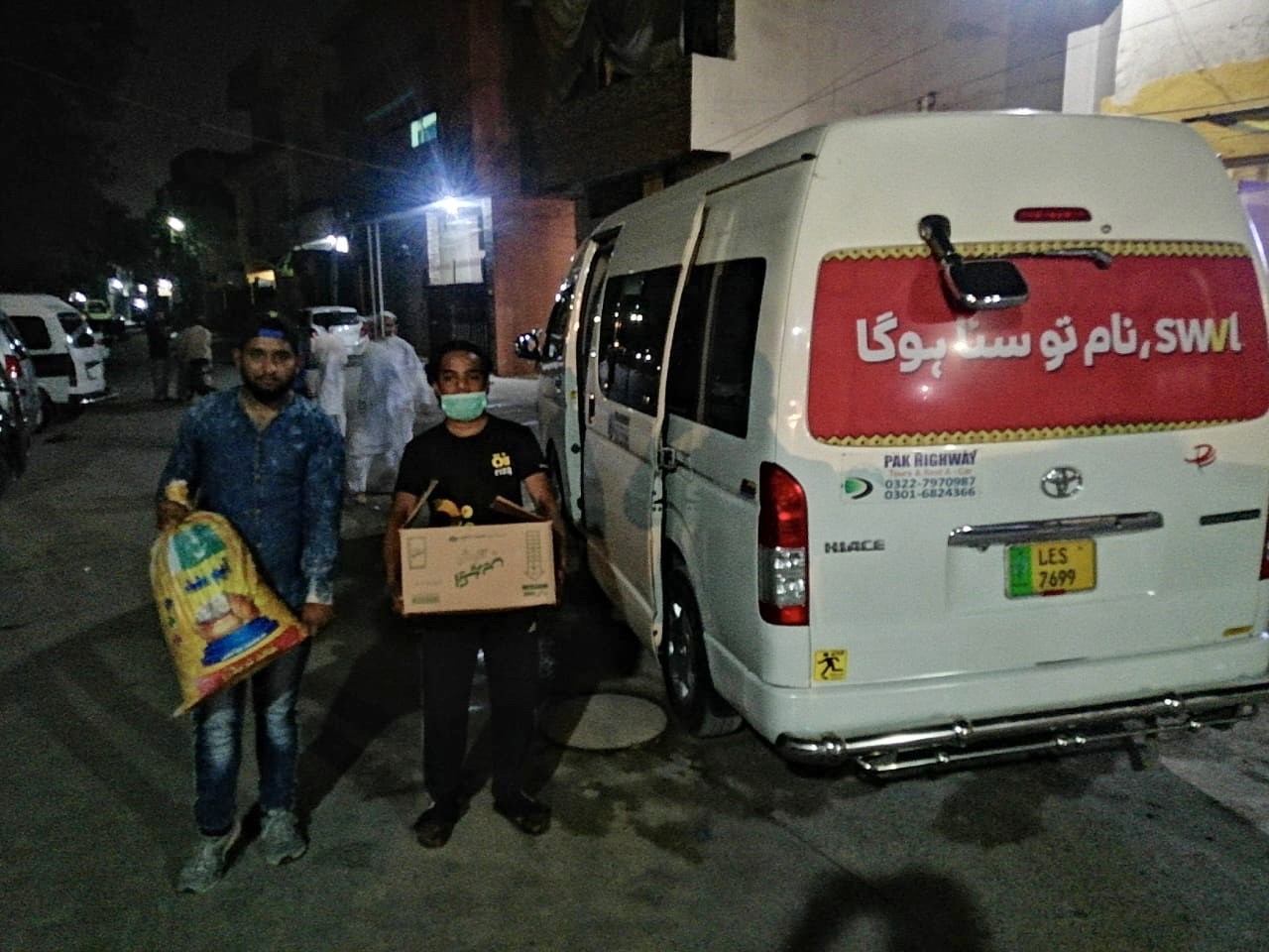 Egyptian transportation company Swvl and representatives of Rizq are distributing food packages in Lahore on March 23, 2020. (Photo courtesy: Rizq)
