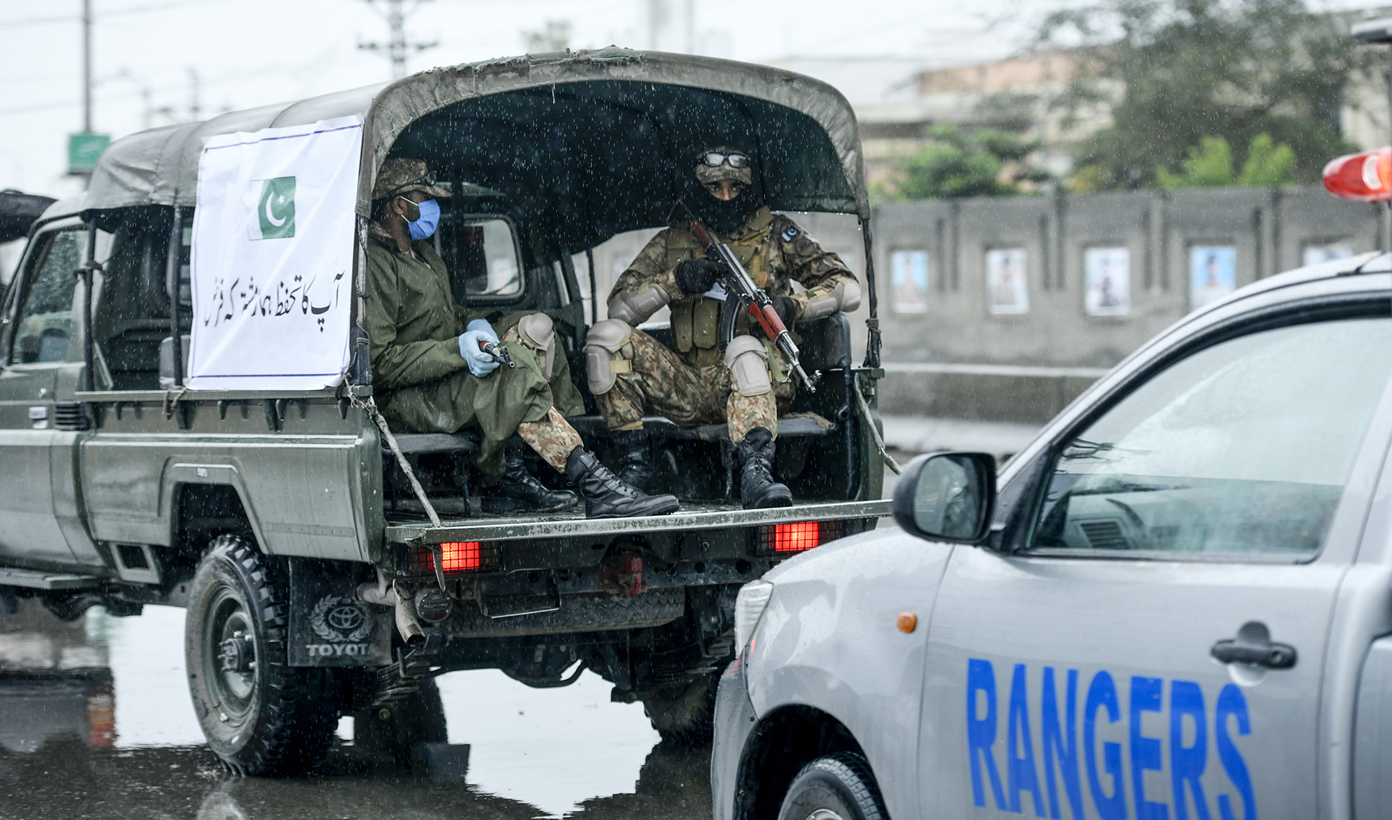 Army, rangers, police and medical personnel patrol on a road during a government-imposed lockdown as a preventive measure against the COVID-19 coronavirus, in Rawalpindi on March 24, 2020. (AFP)