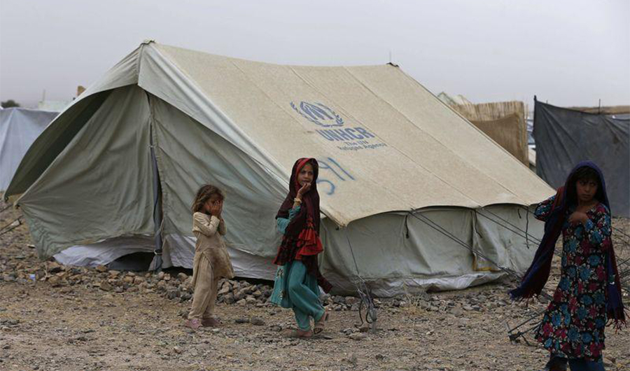 Displaced Pakistani children play outside their tent at a refugee camp in Khost province July 2, 2014. (REUTERS)