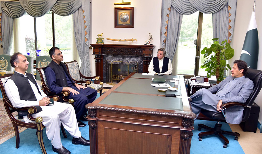 Minister for Planning Mr. Asad Umer and Minister for Power Mr. Omar Ayub Khan call on Prime Minister Imran Khan at Islamabad on March 20, 2020. (PID photo)