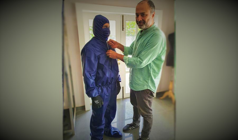 In this undated photo, designer Deepak Perwani inspects a Personal Protection Equipment suit in Karachi. (Photo Courtesy: Deepak Perwani)