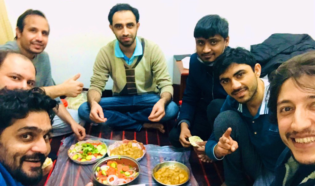 The photograph released by the Chinese Embassy in Pakistan's Twitter account on April 8, 2020 shows Pakistani students stranded in Wuhan celebrating the end of months-long lockdown due to the COVID-19 coronavirus outbreak. (Photo courtesy: @CathayPak/Twitter)