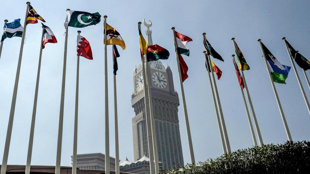 In this file photo, flags of Organization of Islamic Cooperation member-states fly in front of the Abraj al-Bait Towers in Makkah on Nov. 17, 2016. (AFP)