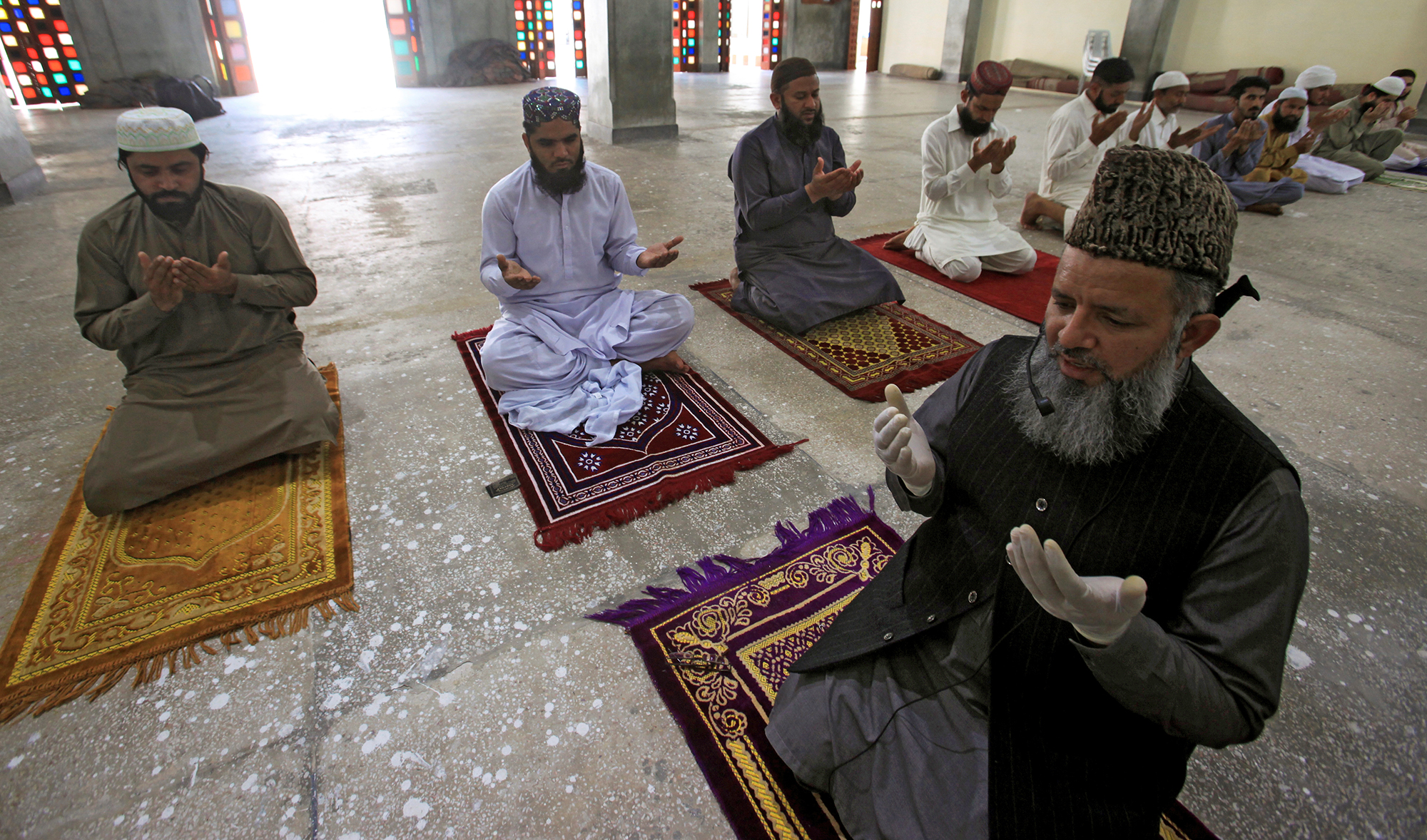 Muslims maintain safe distance as they attend Friday prayer after government limited congregational prayers and ordered to stay home, in efforts to stem the spread of the coronavirus disease (COVID-19), in Lahore on April 10, 2020. (REUTERS)