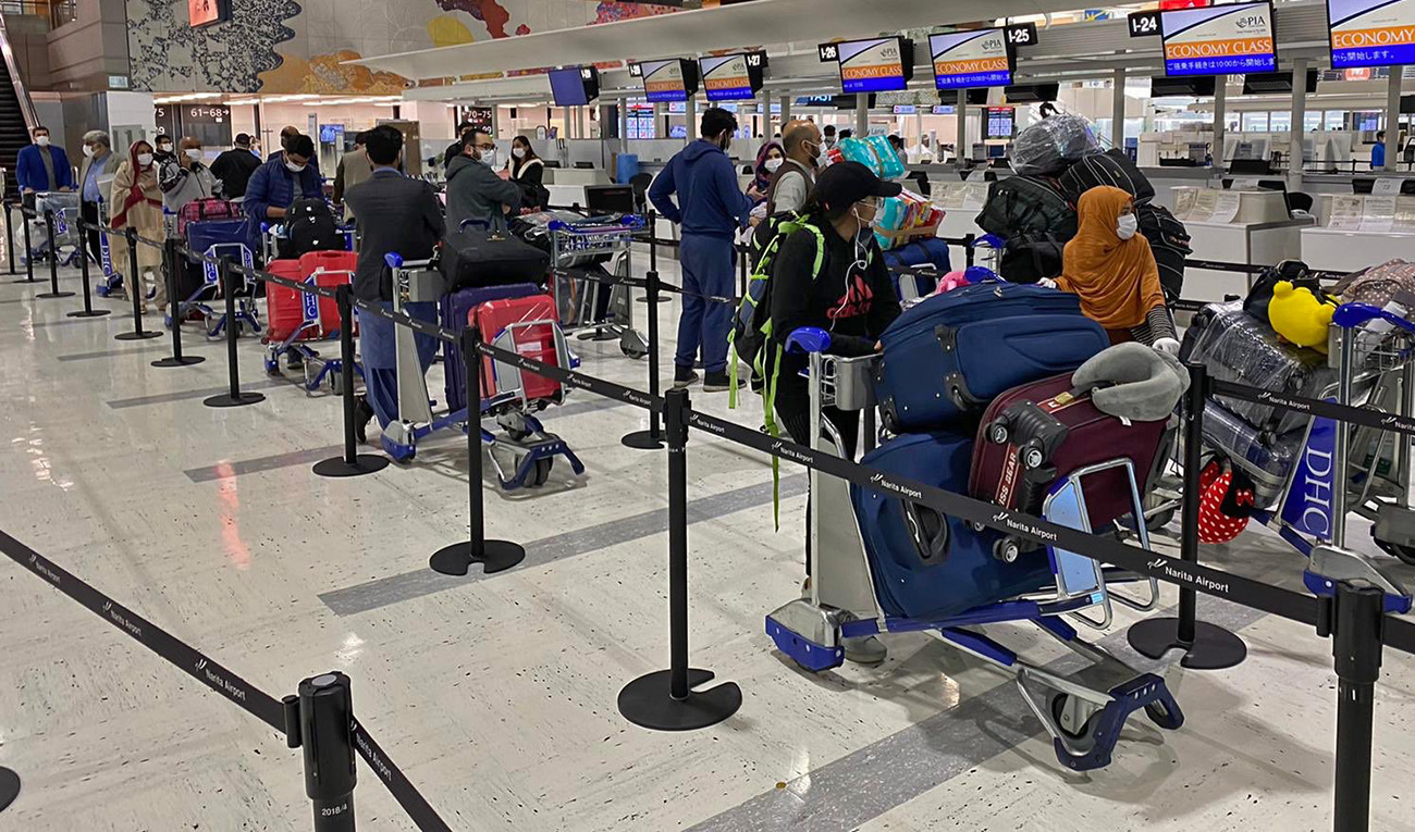 The photograph released by Pakistan's foreign ministry on April 14, 2020 shows stranded Pakistanis queuing up at the airport in Tokyo. (Photo courtesy: MOFA Pakistan/Twitter)