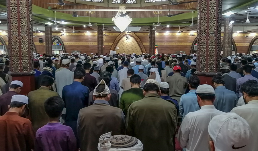Muslims offer Friday prayers at the Red Mosque during a government-imposed nationwide lockdown as a preventive measure against the COVID-19 coronavirus, in Islamabad on April 17, 2020. (AFP)