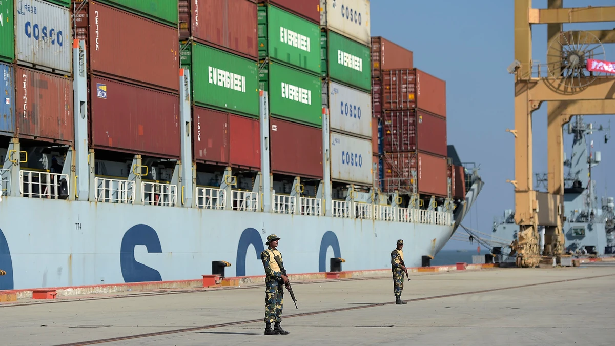 In this file photo, Pakistani Naval personnel stand guard beside a ship carrying containers during the opening of a trade project in Gwadar port, some 700 kms west of Karachi on Nov. 13, 2016. (AFP)
